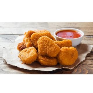 Menu de Nuggets de pollo 8und +patatas O Arroz +1 Lata 