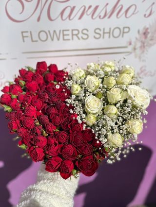White and red spray roses in heart shaped box