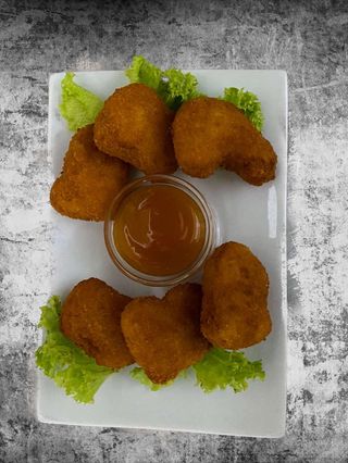 Курячі нагетсі з кисло-солодким  соусом(150/30)