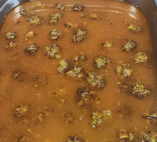 Albóndigas en salsa (porción) con patatas fritas 