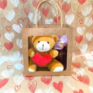 Bolsa regalo con peluche corazón rojo y flor de orquídea 
