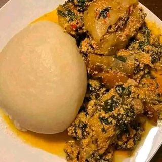 Pounded yam served with egusi mixed with Assorted meat