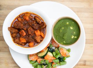 Spicy Pork Stew With fried mchicha and seasonal vegetables.