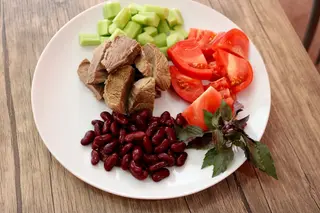 Boiled beef with vegetables on grill 
