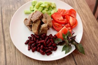 Boiled beef with vegetables on grill 