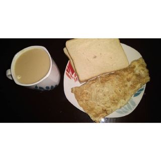 Omlette served with milk tea & bread