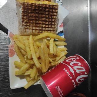 Taco de pollo + Coca-Cola Sabor Original lata 330ml.