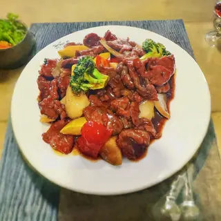56.  Ternera con salsa de ostras