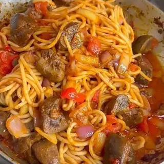 Sphaghetti Jollof mixed with peppered Gizzards 