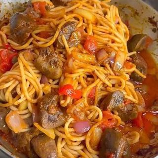 Sphaghetti Jollof mixed with peppered Gizzards 