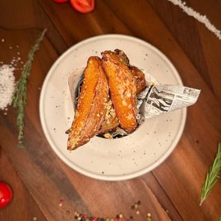 Wedges homemade potatoes with parmesan