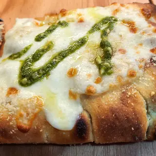 Pizza Pesto - Porción triangular