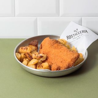 Cotoletta alla milanese di pollo con patate arrosto