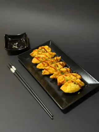 Fried salmon gyoza