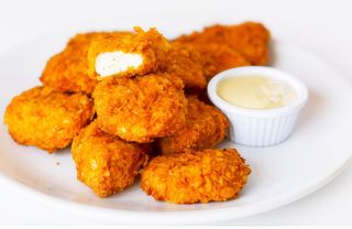 9 Nuggets De Pollo Con Salsa Deluxe (Ración)