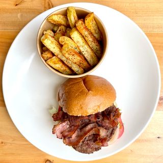 Beef and Bacon Burger with spicy fries and BBQ sauce