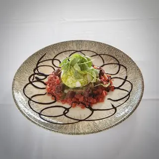 Burrata aliñada con pesto