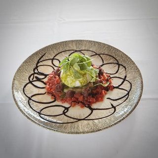 Burrata aliñada con pesto