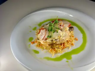 Запечений Хек на подушці з рису та грибів (150/100g)