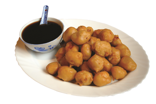 Панирани пилешки хапки със сладко кисел сос (500г)