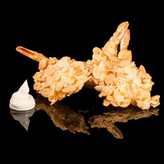 54. Gamberoni impanati con mandorle