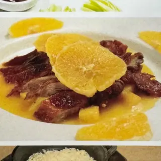Pato con salsa naranja