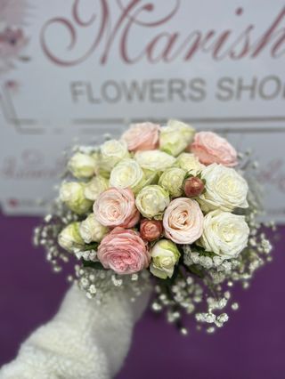 Wedding bouquet with roses and gypsophila