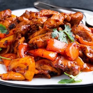 Chilly and garlic chicken served with rice or noodles 