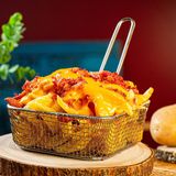 Patatas caseras con queso cheddar y bacon crispy