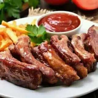 Sticky Barbeque goat ribs with served with chips