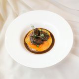 Beef cheeks with eggplant puree and demi-glace sauce