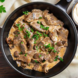 Ternera en salsa de champiñones