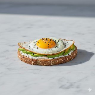 Tostada Aguacate, Queso Crema, Huevo Frito Y Sésamo