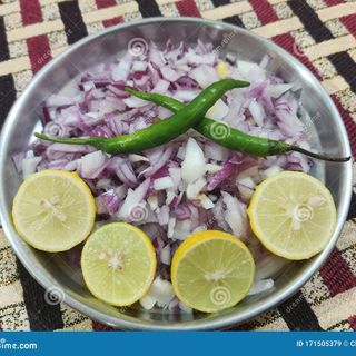 Onion salad , green chilli, lemon
