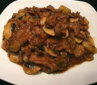 Ternera con champiñones