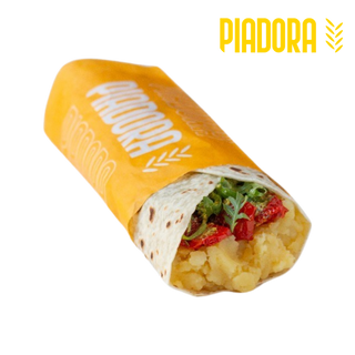 Patate bollite, pomodorini secchi, rucola e pesto di pistacchi