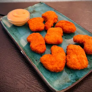 Курячі нагетси 3 сирним соусом (170/50г)
