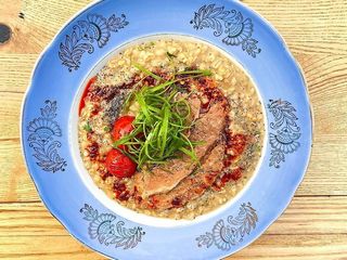 Каша з бріскетом і томатами