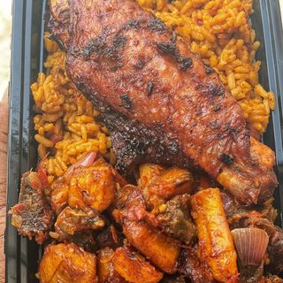 Jollof Rice mixed with gizdodo served with peppered turkey and a can of palm wine