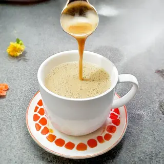 A pot of African tea with sugar