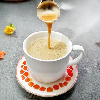 A pot of African tea with sugar