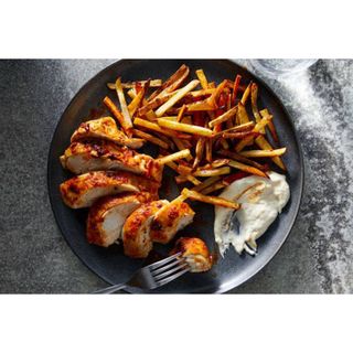 Pan fried boneless chicken fillet and chips 