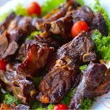 Pan fried goat  meat with chips