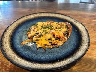 Свинина під сирною скоринкою (250г)