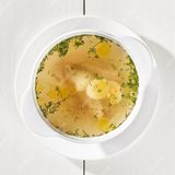 Бульйон курячий з грінками  , перепелиними  яйцями  та зеленню