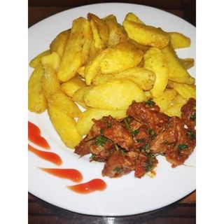 Pan Fried Goat's Meat With Boiled Sweet Potato