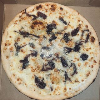 Pizza Caramelizada, Mediana