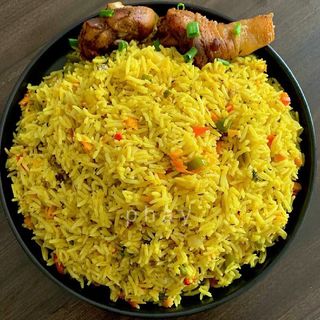 Jollof rice/Fried rice + plantain + chicken/fish