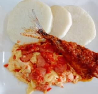 Boiled yam and egg sauce with Titus fish 