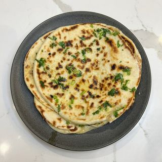 Garlic Naan. (Served In 2S)